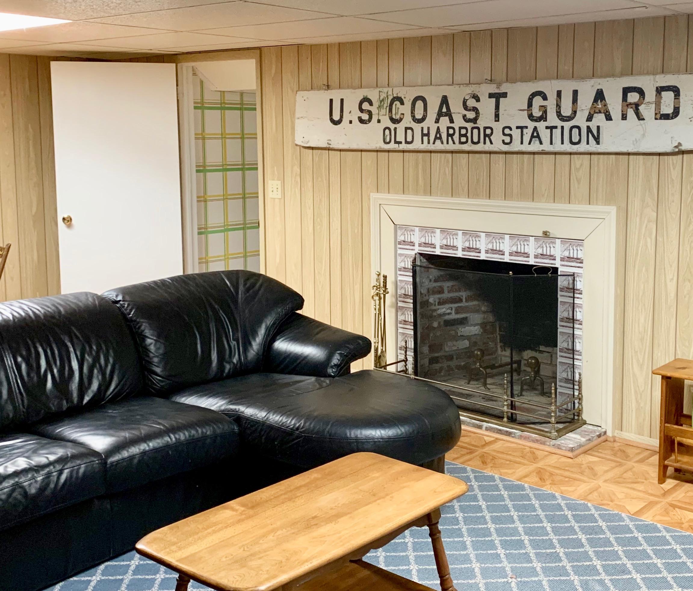 265 Bay Road Harwich, MA 02645 - Photo 22 of 38 a living room with furniture window and a fireplace