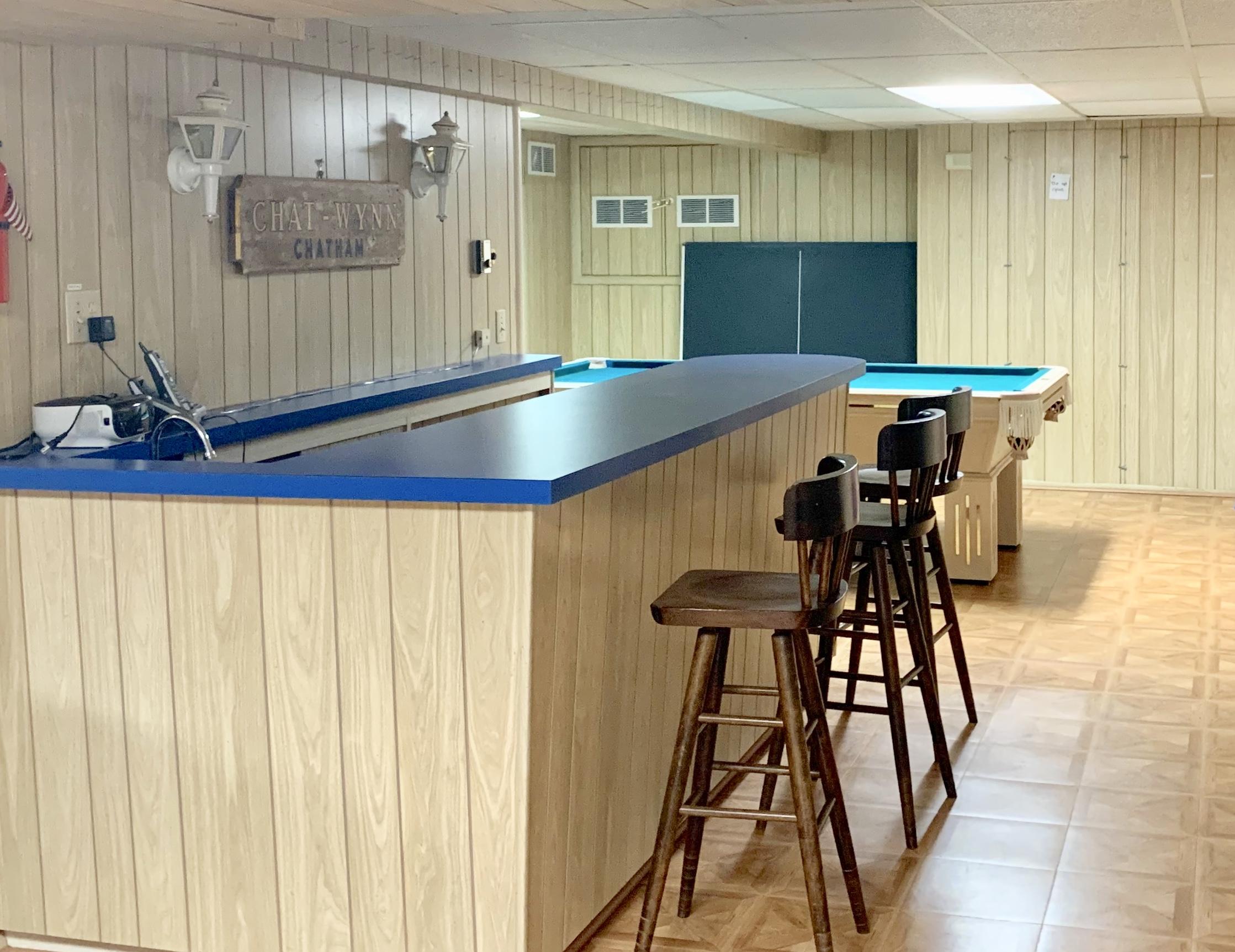 265 Bay Road Harwich, MA 02645 - Photo 24 of 38 a view of a dining room with furniture and a table
