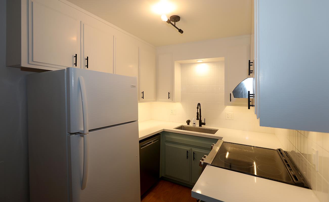 1124 Hollywood Avenue, Unit 3 Oakland, CA 94602 - Photo 3 of 11 a kitchen with a refrigerator and a sink