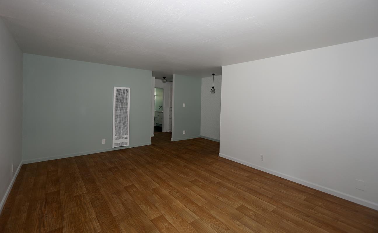 1124 Hollywood Avenue, Unit 3 Oakland, CA 94602 - Photo 8 of 11 a view of an empty room and wooden floor