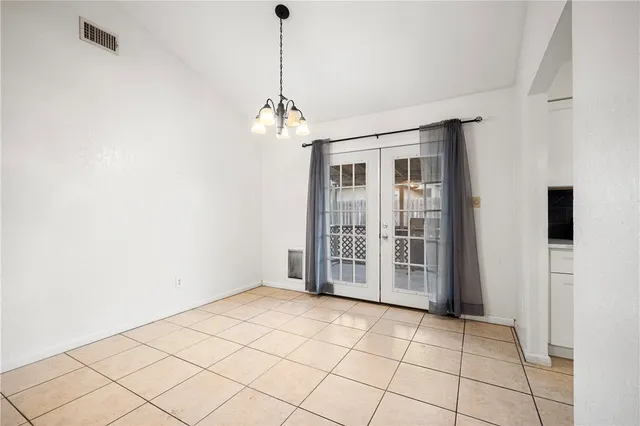 a view of empty room with windows