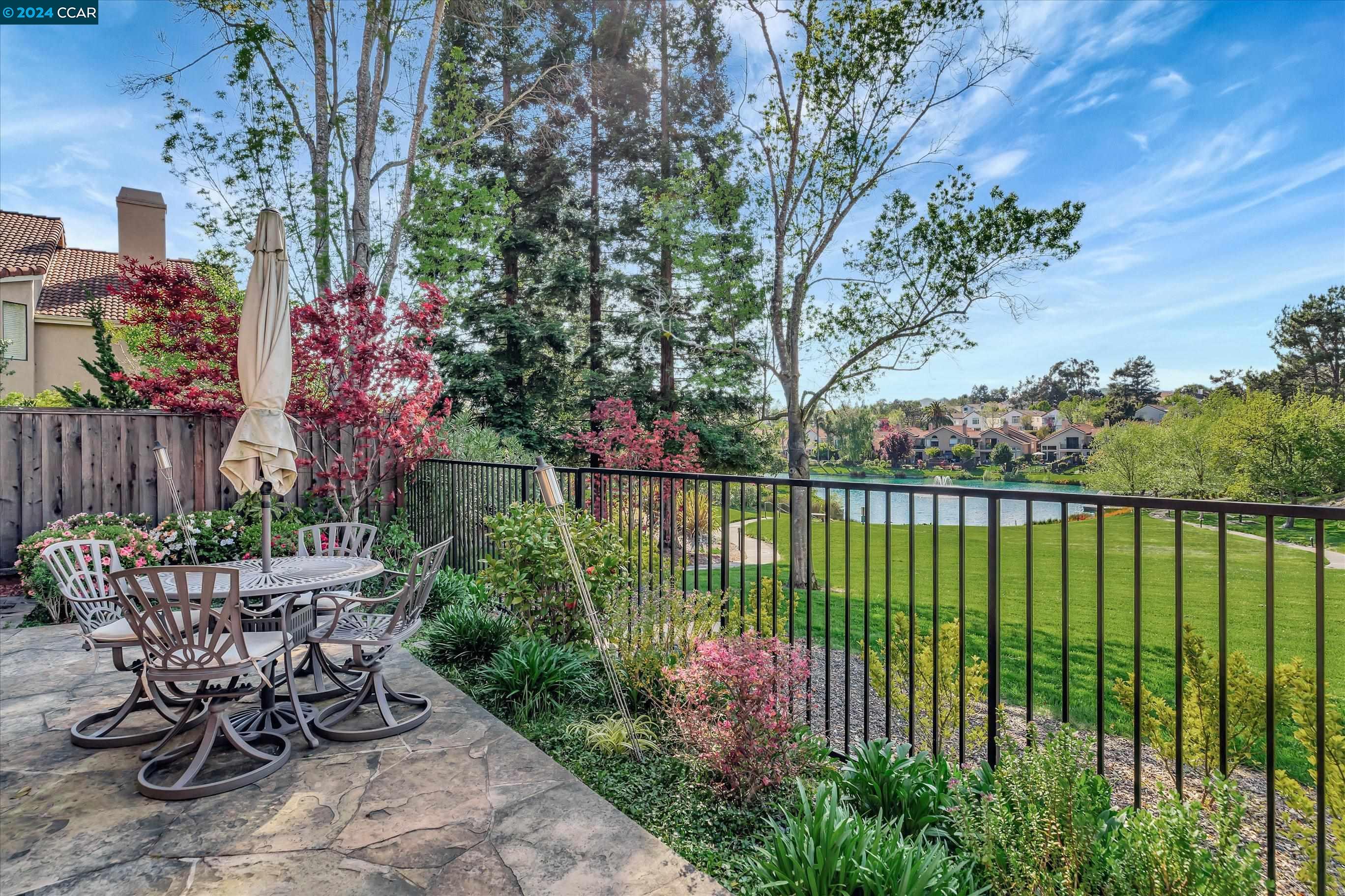 a view of a garden with sitting area
