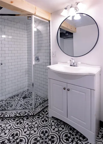 a bathroom with a sink a mirror and vanity