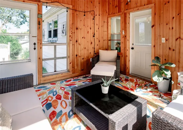 a living room filled with furniture and a table