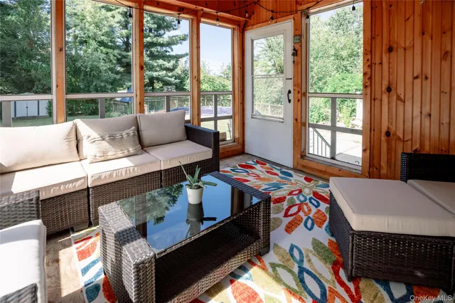 a bedroom with furniture and a window