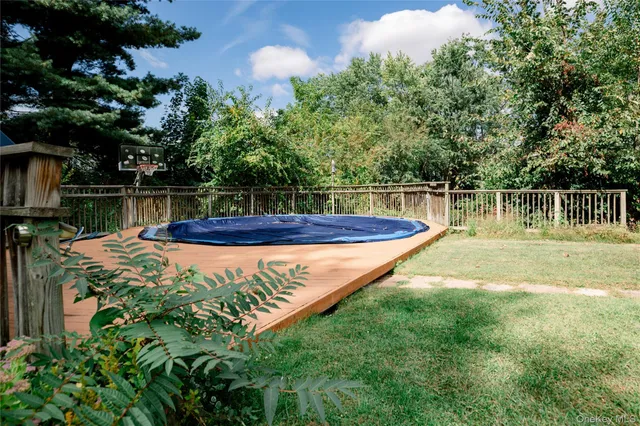 a view of a swimming pool with a lake view