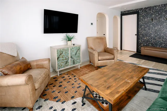 a living room with a couch and a flat screen tv