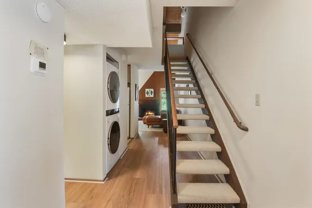 a view of staircase with white walls and window