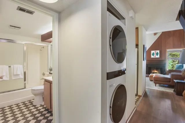 a view of a bedroom with washer and dryer