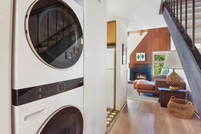 an outdoor living room with furniture and a mirror