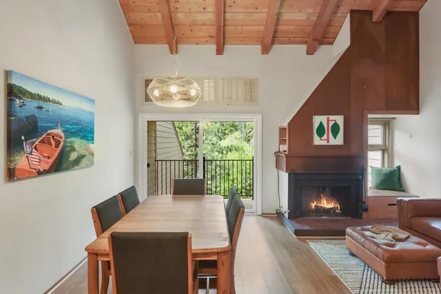 a living room with furniture a window and a fireplace