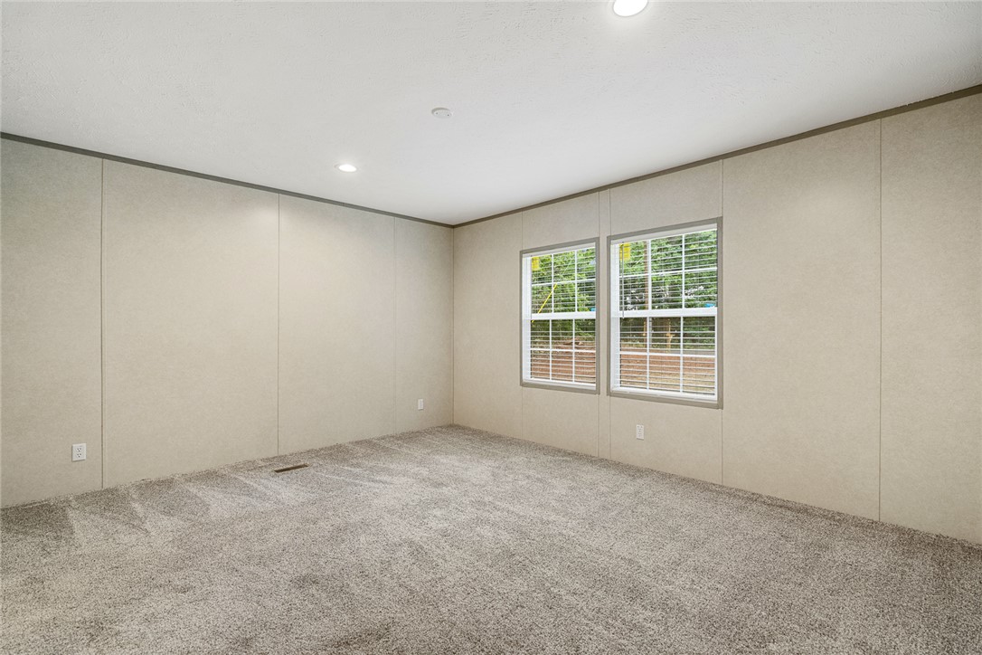 419 Austin Drive Anderson, SC 29624 - Photo 21 of 36 This spacious room offers comfortable carpeting and ample natural light, ideal for peaceful relaxation.