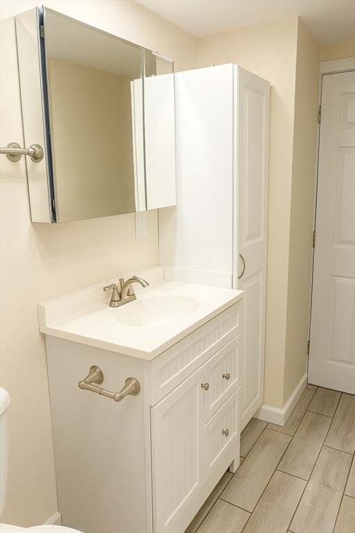1042 Sassaquin Avenue, Unit 2 New Bedford, MA 02745 - Photo 12 of 13 a bathroom with a sink a mirror and a shower