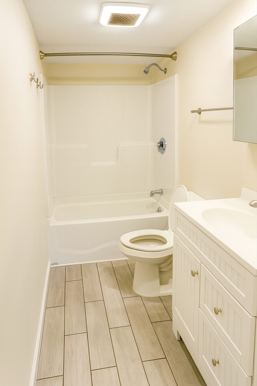 1042 Sassaquin Avenue, Unit 2 New Bedford, MA 02745 - Photo 13 of 13 a bathroom with a toilet a sink and shower
