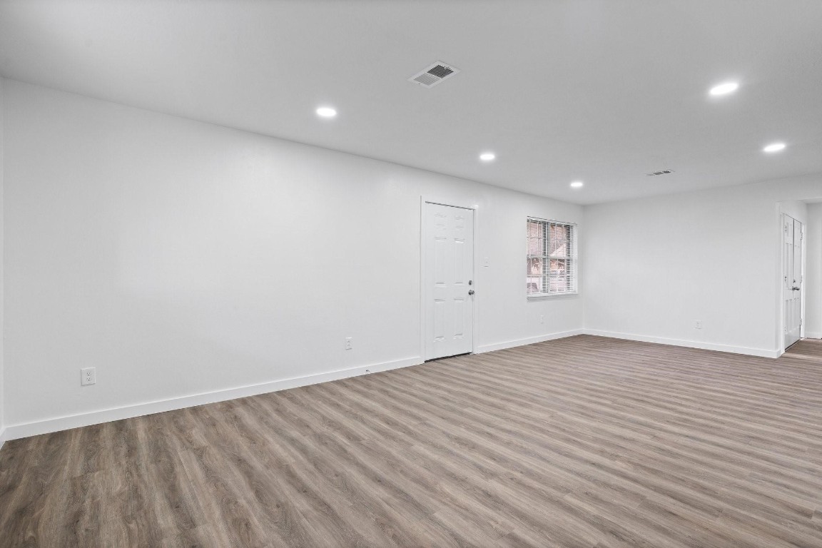 322 East Edgebrook Drive Houston, TX 77034 - Photo 11 of 38 a view of an empty room with wooden floor