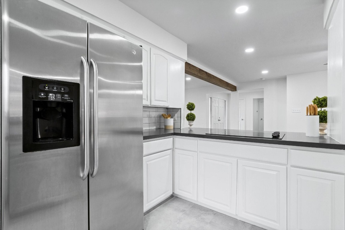 322 East Edgebrook Drive Houston, TX 77034 - Photo 15 of 38 a kitchen with granite countertop white cabinets and white appliances