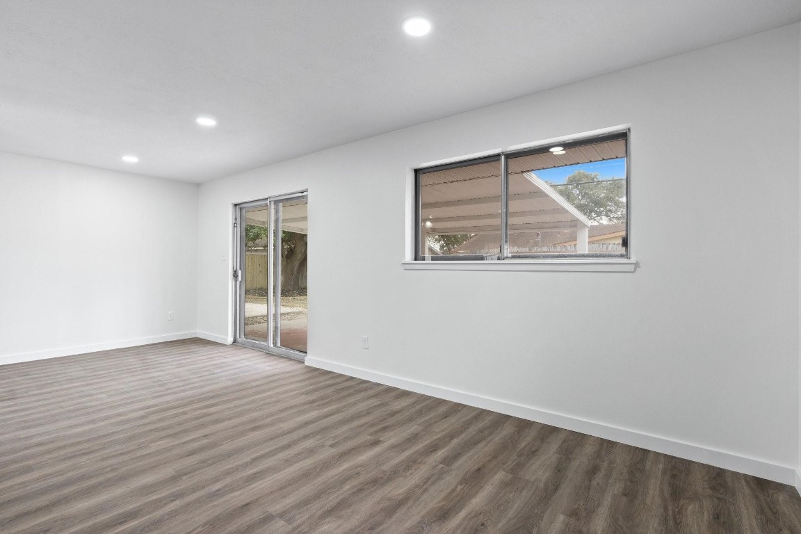 322 East Edgebrook Drive Houston, TX 77034 - Photo 19 of 38 a view of an empty room with wooden floor and a window