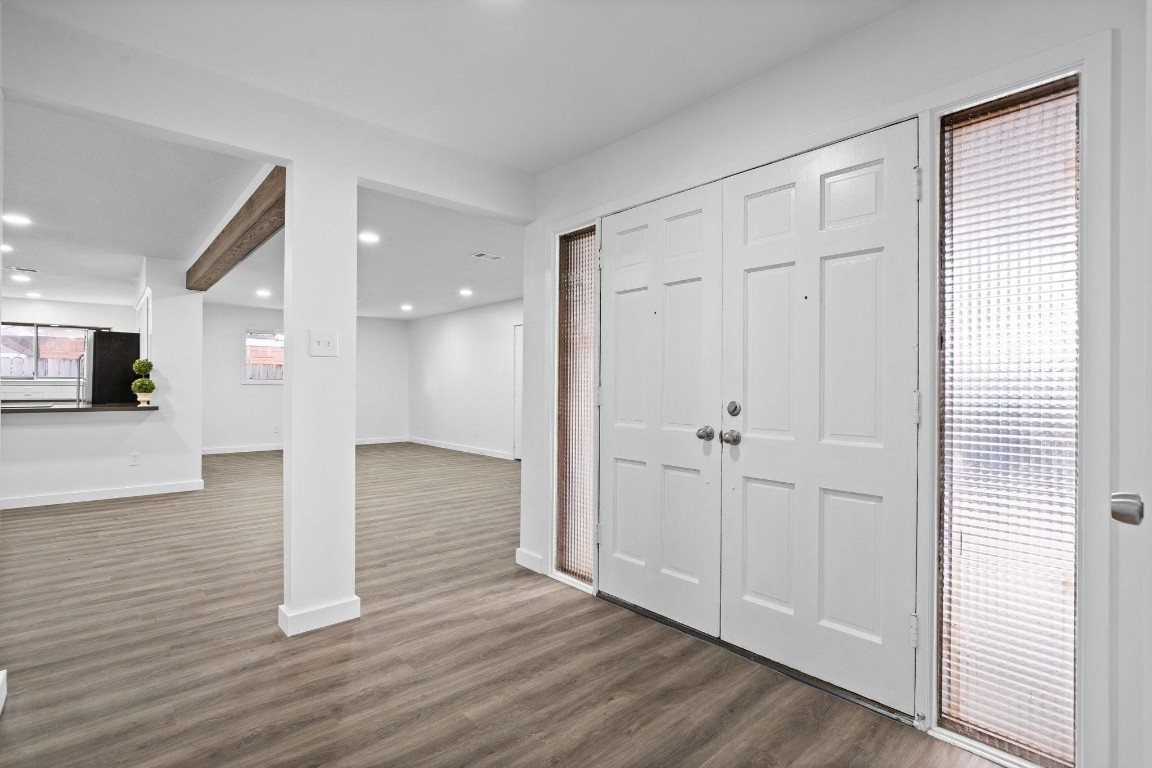 322 East Edgebrook Drive Houston, TX 77034 - Photo 3 of 38 a view of a hallway with wooden floor