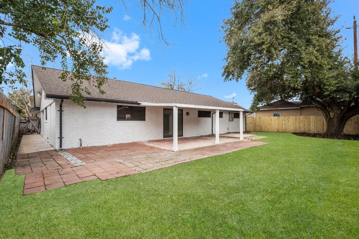 322 East Edgebrook Drive Houston, TX 77034 - Photo 36 of 38 a view of a house with a back yard