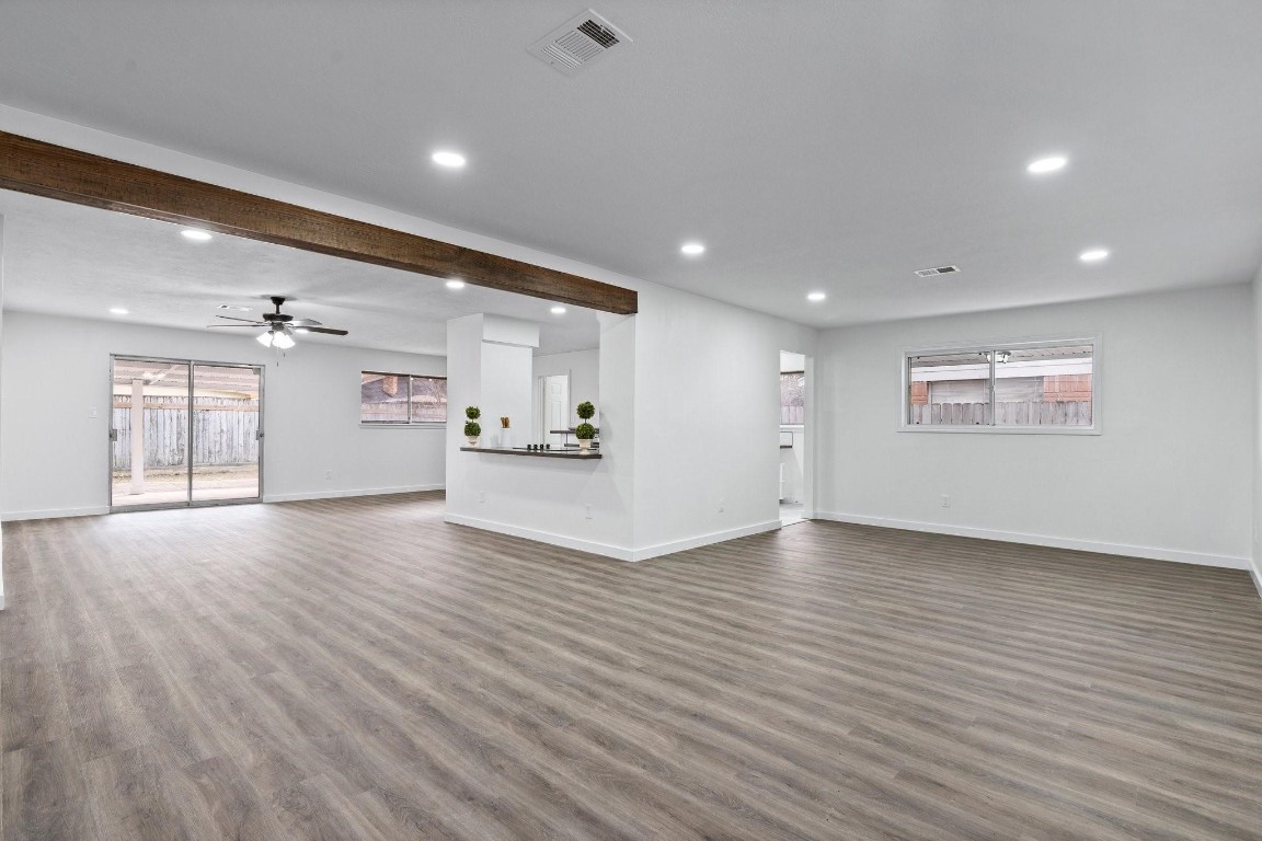 322 East Edgebrook Drive Houston, TX 77034 - Photo 5 of 38 a view of an empty room with a window and wooden floor
