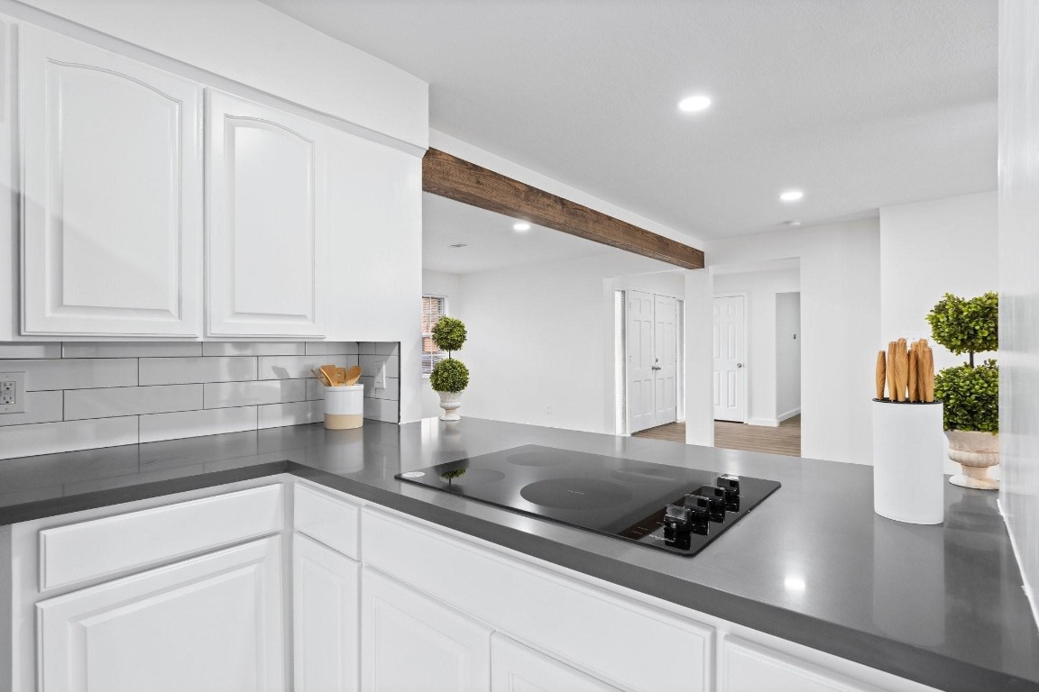 322 East Edgebrook Drive Houston, TX 77034 - Photo 6 of 38 a kitchen with a sink and white cabinets