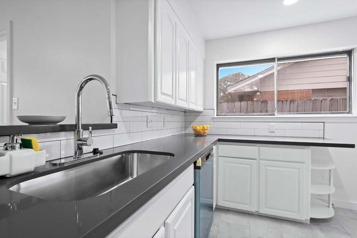 322 East Edgebrook Drive Houston, TX 77034 - Photo 8 of 38 a kitchen with a sink and cabinets