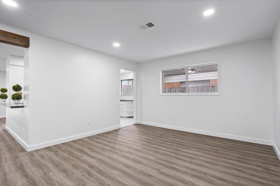 322 East Edgebrook Drive Houston, TX 77034 - Photo 10 of 38 an empty room with wooden floor and windows
