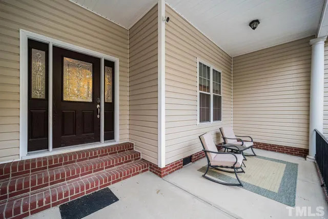 a view of a two chairs in the balcony