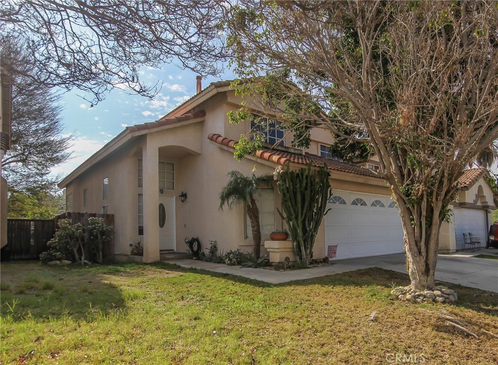 15457 Villaba Road Fontana, CA 92337 - Photo 1 of 1 a view of a house with a yard