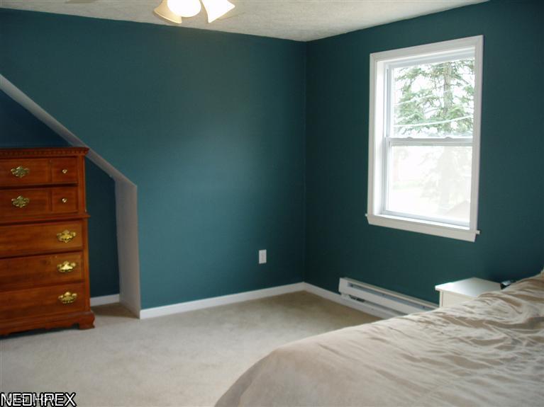 1800 Clyde Road Madison, OH 44057 - Photo 4 of 25 The owner raised the roof on this former bungalow. Two bedrooms; including this large Master and a full bath are on the second floor.