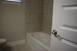 a view of bedroom with wooden floor