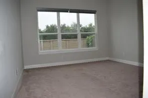 a front view of a house with large windows