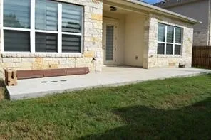 a view of front door of house and yard