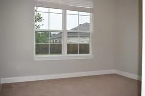 a bathroom with a granite countertop sink and a toilet