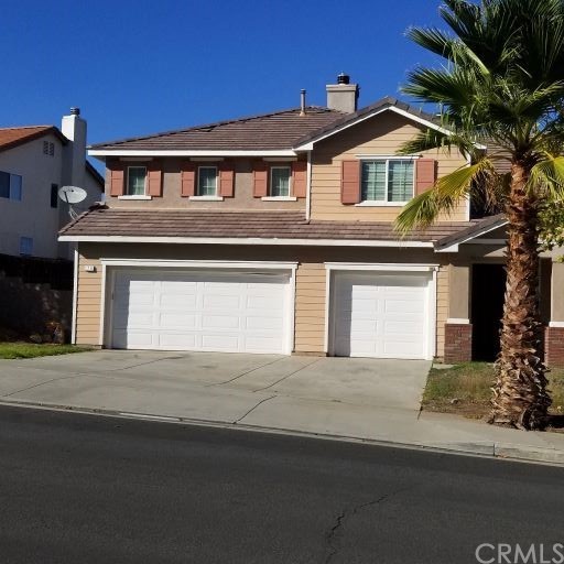 170 Alabaster Loop Perris, CA 92570 - Photo 1 of 1 a front view of a house with a garage