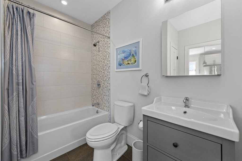 72-74 Manthorne Road, Unit 74 Boston, MA 02132 - Photo 15 of 22 a bathroom with a sink toilet and shower