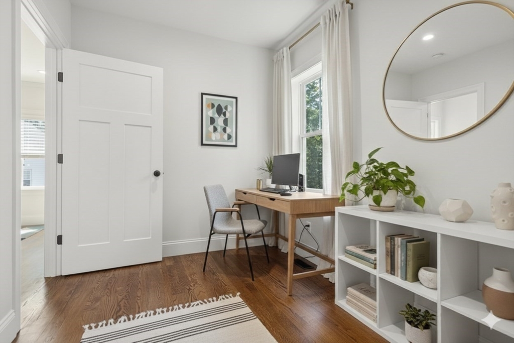 72-74 Manthorne Road, Unit 74 Boston, MA 02132 - Photo 16 of 22 a workspace with furniture window and wooden floor