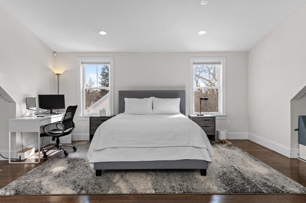 72-74 Manthorne Road, Unit 74 Boston, MA 02132 - Photo 17 of 22 a bedroom with a bed and a desk