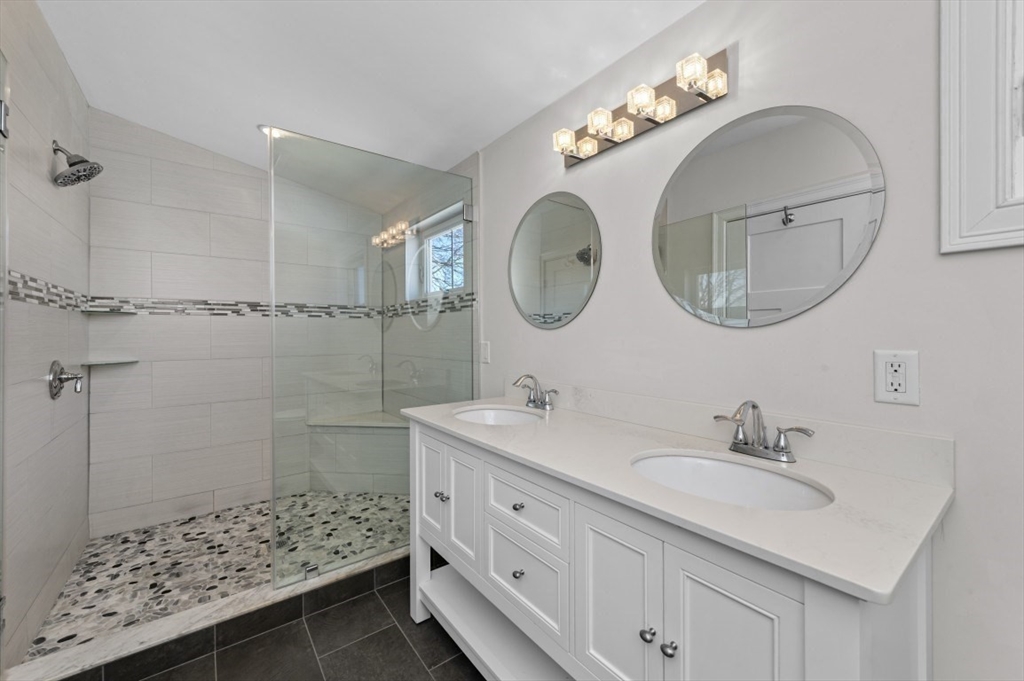 72-74 Manthorne Road, Unit 74 Boston, MA 02132 - Photo 18 of 22 a bathroom with a sink and a mirror