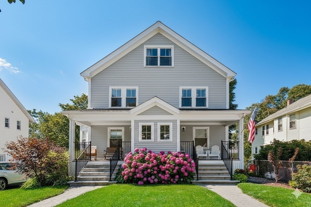 72-74 Manthorne Road, Unit 74 Boston, MA 02132 - Photo 2 of 22 a front view of a house with a yard