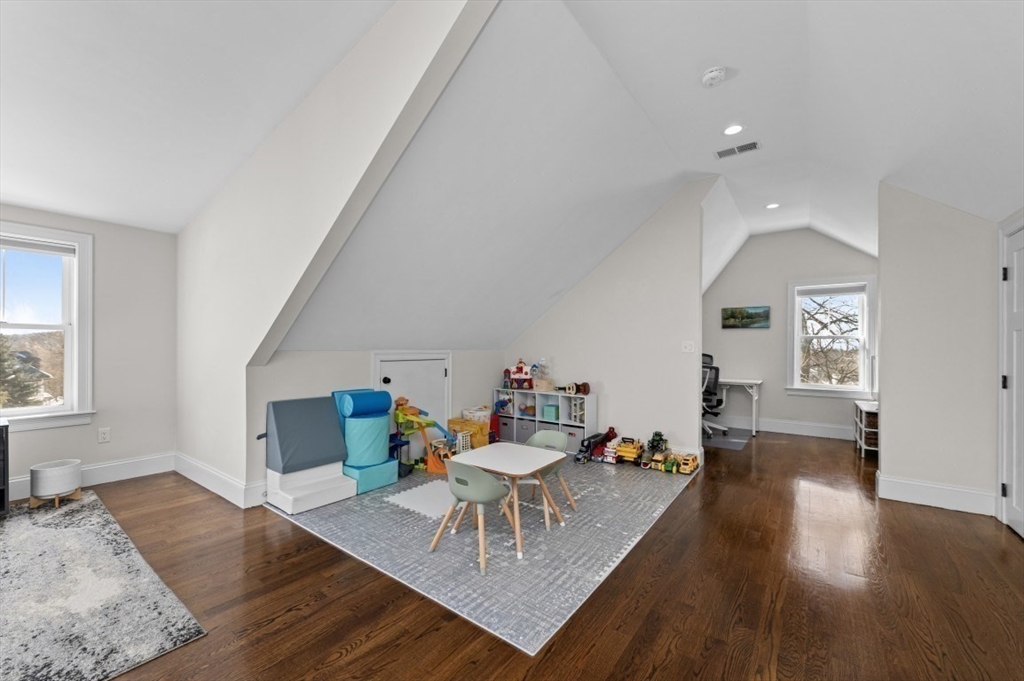 72-74 Manthorne Road, Unit 74 Boston, MA 02132 - Photo 21 of 22 a living room with furniture and a wooden floor