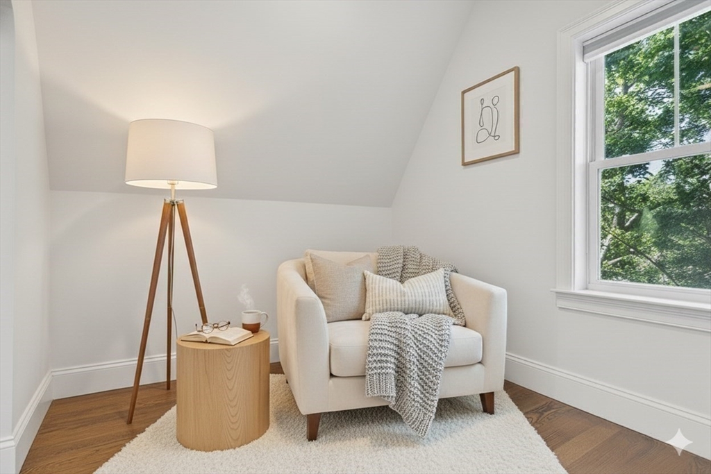 72-74 Manthorne Road, Unit 74 Boston, MA 02132 - Photo 22 of 22 a living room with furniture a window and a lamp
