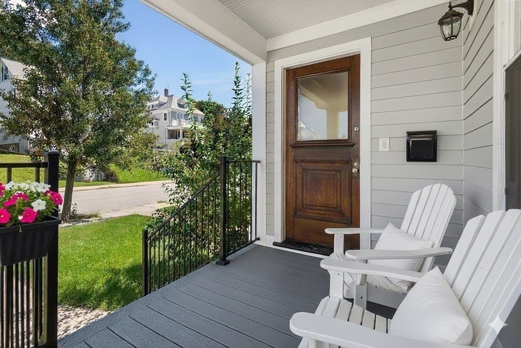72-74 Manthorne Road, Unit 74 Boston, MA 02132 - Photo 4 of 22 a view of two chairs in a patio