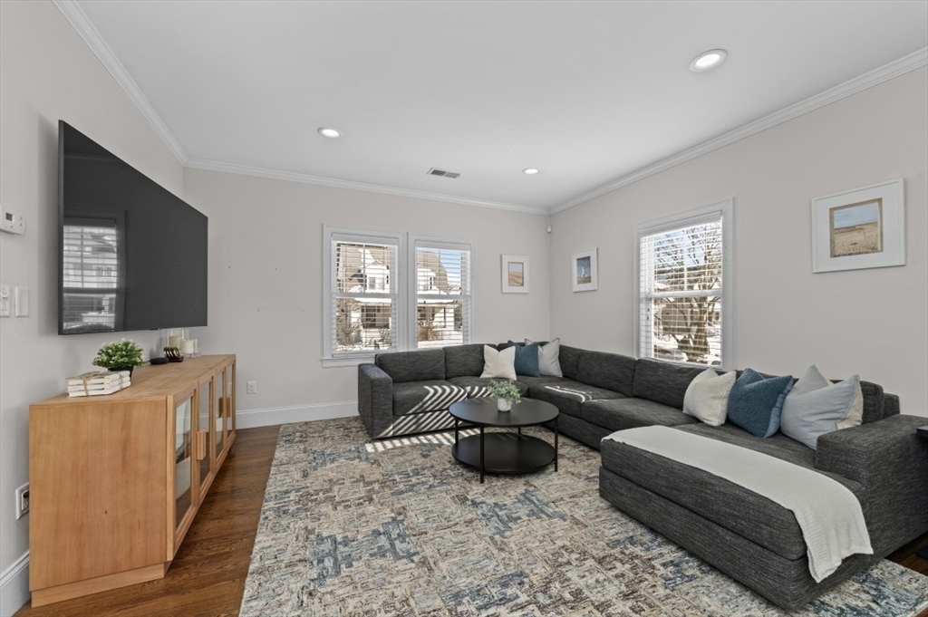 72-74 Manthorne Road, Unit 74 Boston, MA 02132 - Photo 5 of 22 a living room with furniture window and wooden floor