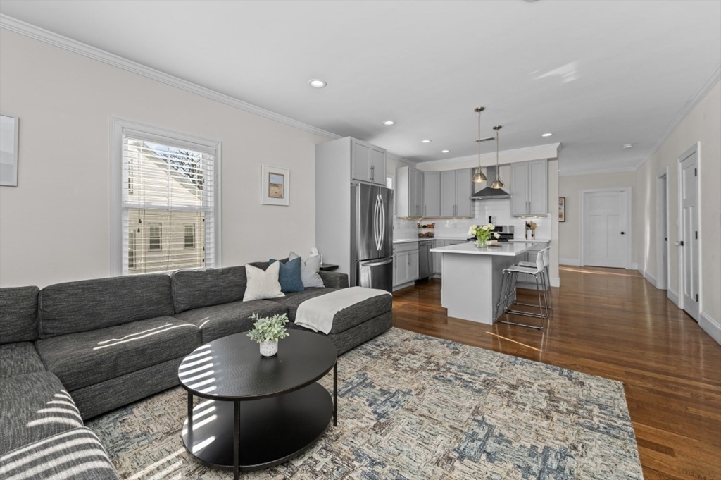 72-74 Manthorne Road, Unit 74 Boston, MA 02132 - Photo 6 of 22 a living room with furniture and a couch