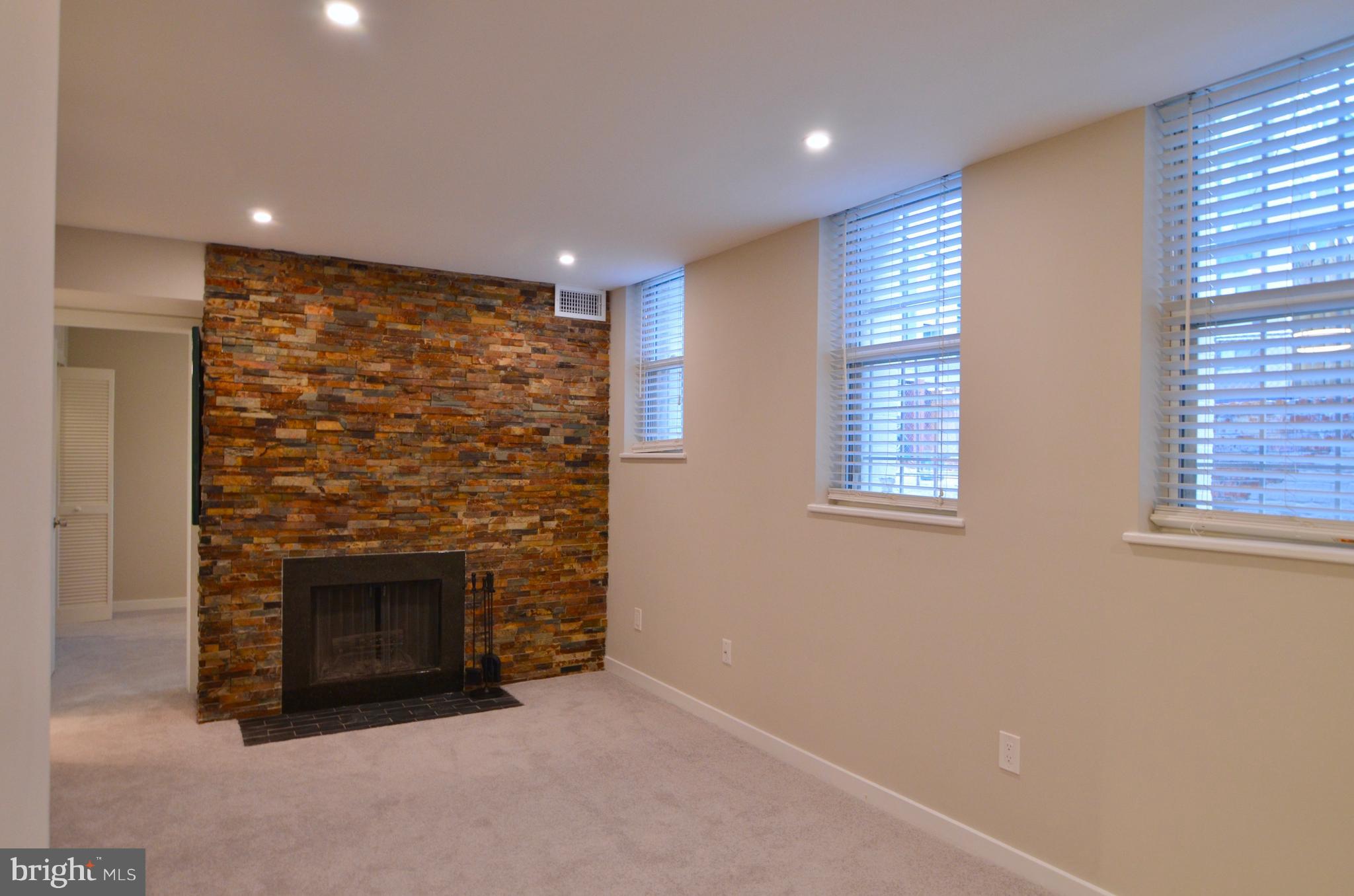 2114 N Street Northwest, Unit 2 Washington, DC 20037 - Photo 10 of 24 an empty room with a fireplace