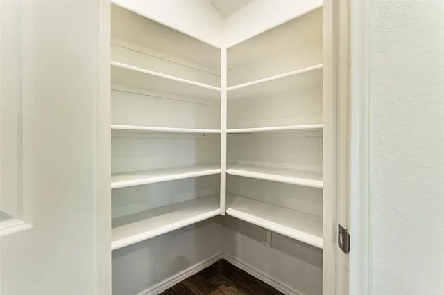 a view of an empty walk in closet