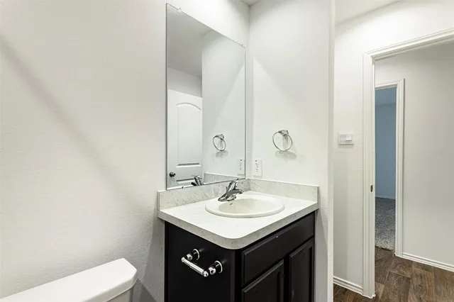 a bathroom with a sink and a toilet