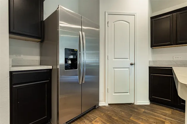 a view of a kitchen from the hallway