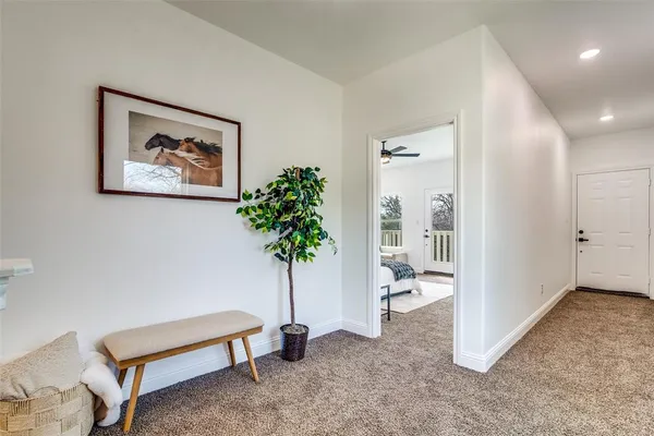 a view of room with furniture and a potted plant